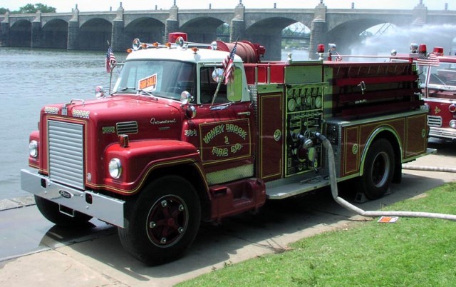 Former Engine 33-1 at the 2004 Pump Primers Muster in Harrisburg.  Barry Messner and Kirby Hills pumping out of the Susquehanna River